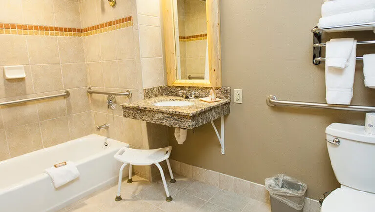 The Bathroom and sink area in the accessible Wolf Den Suite at Great Wolf Lodge NIagara Falls, ON.
